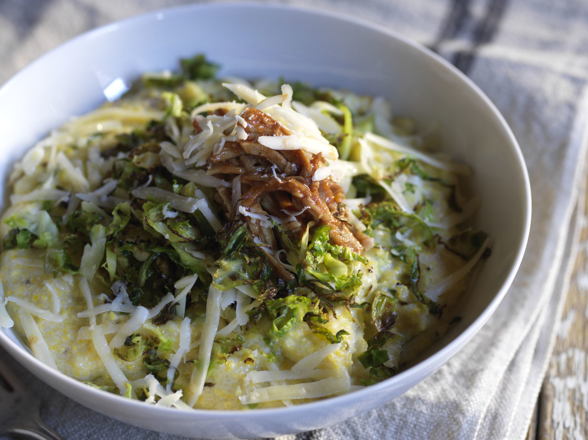 Shaved Brussels Sprouts with Maple Bourbon Pork & Cheddar Grits