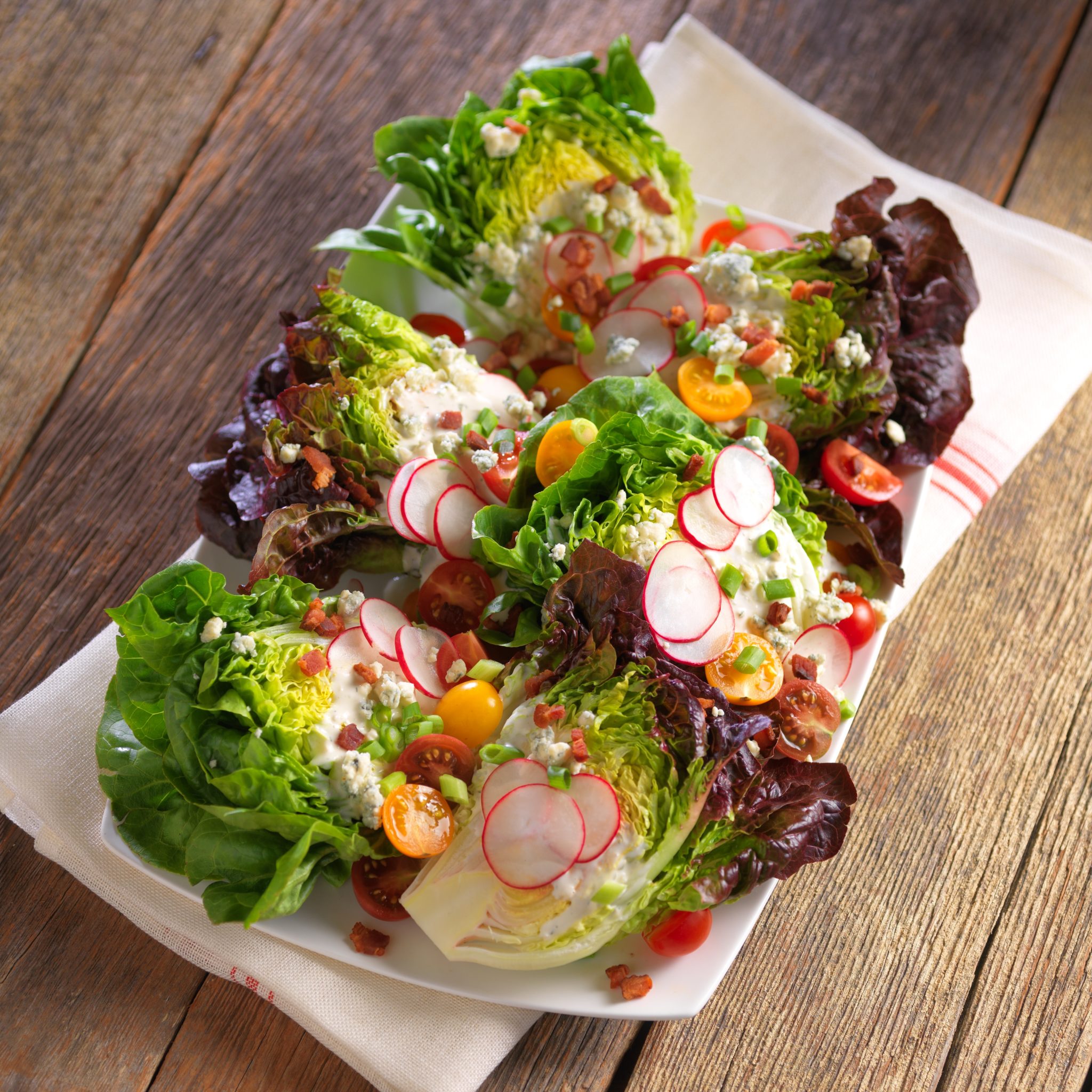 HoneyGem™ Half Heads with Blue Cheese, Bacon and Shaved Radishes - Foodservice by Mann Packing