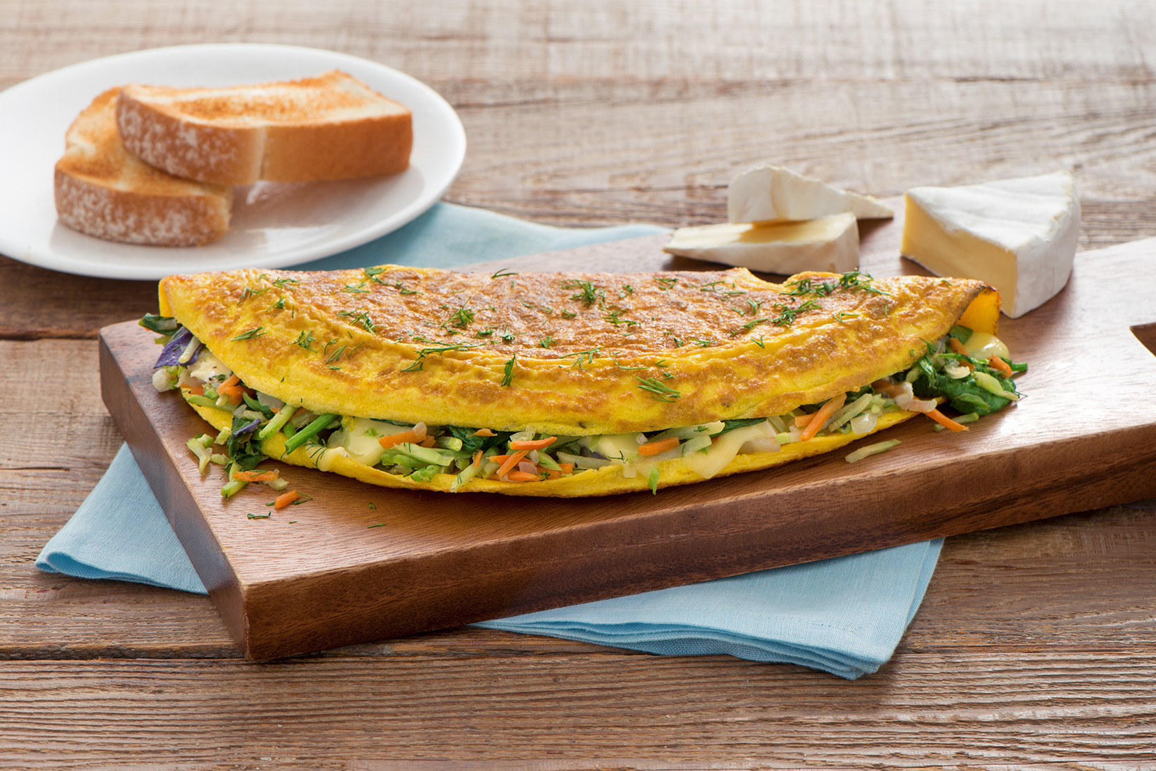 Herbed Brie, Spinach & Broccoli Cole Slaw Omelette - Mann's Fresh Vegetables